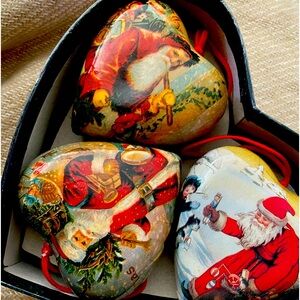 Paper mache christmas vintage themed ornaments in a mache heart shaped box .